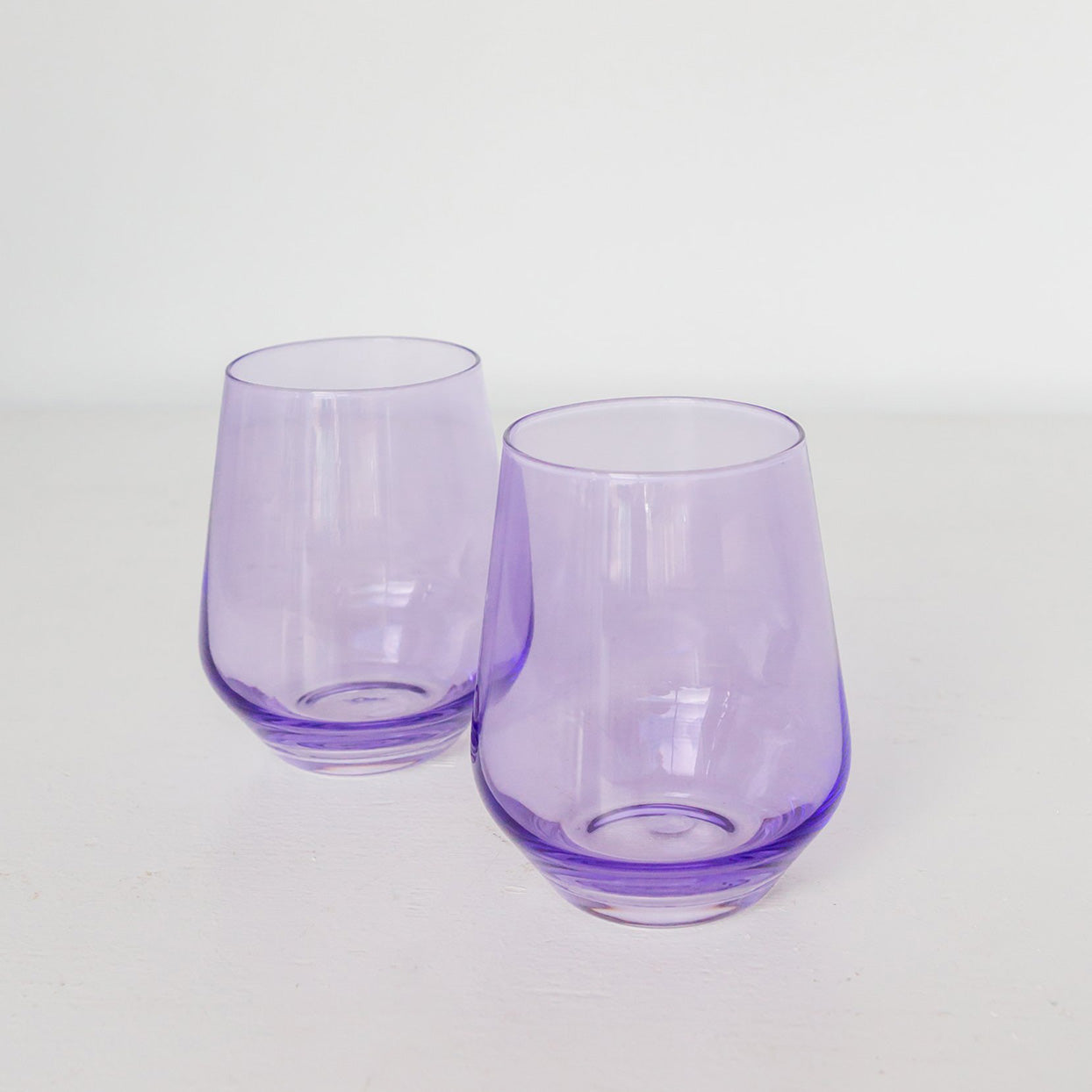 http://estellecoloredglass.com/cdn/shop/articles/purple_tinted_glass.jpg?v=1623306866